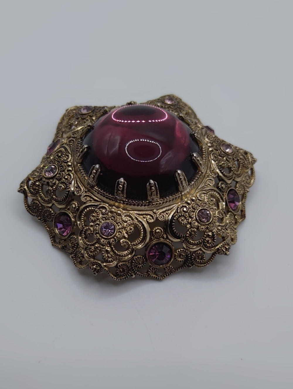 Western Germany Filigree, Purple Glass Cabachon, and Purple Rhinestone Brooch - Picture 3 of 7